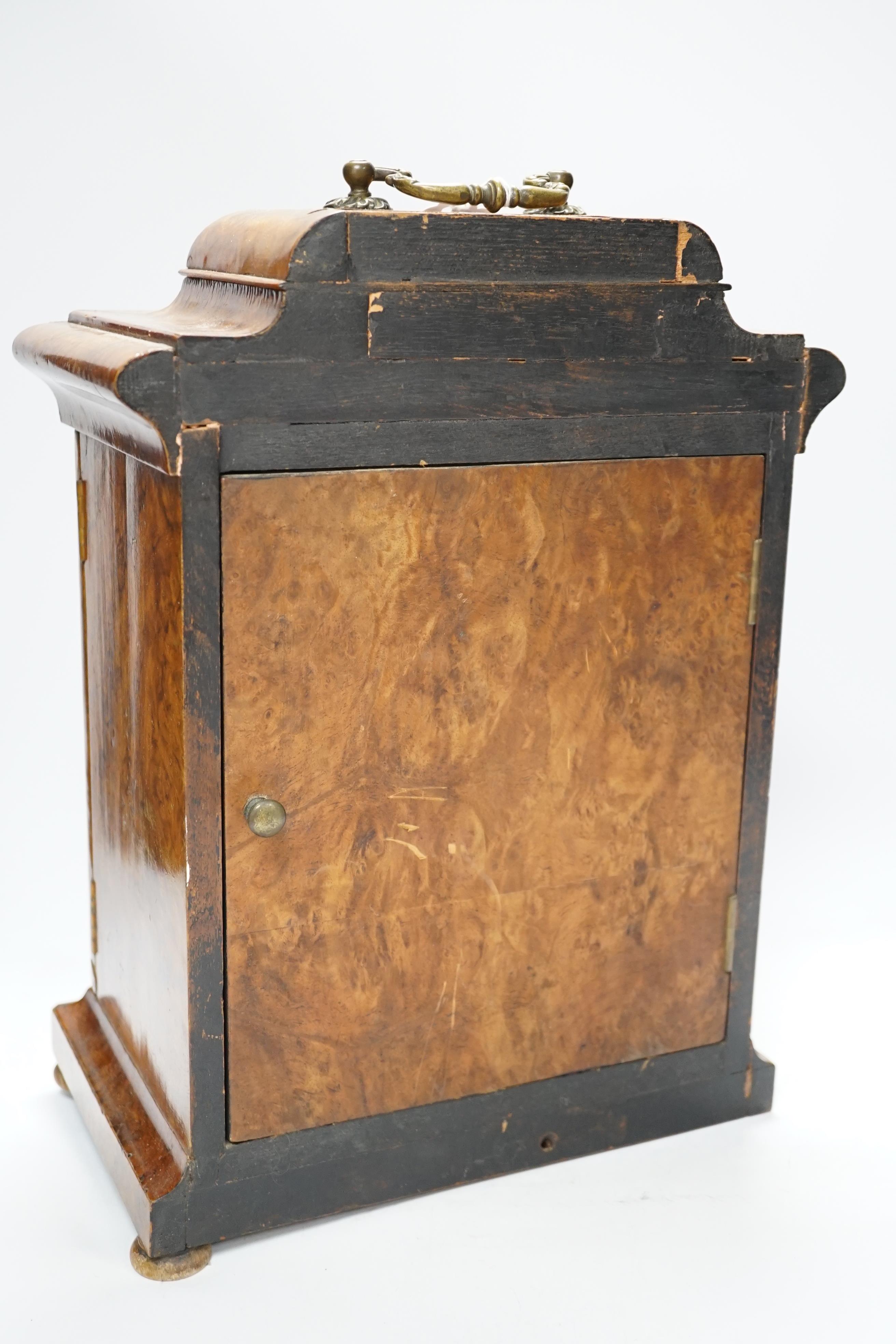A walnut cased mantel timepiece with silvered dial, 37.5cm high